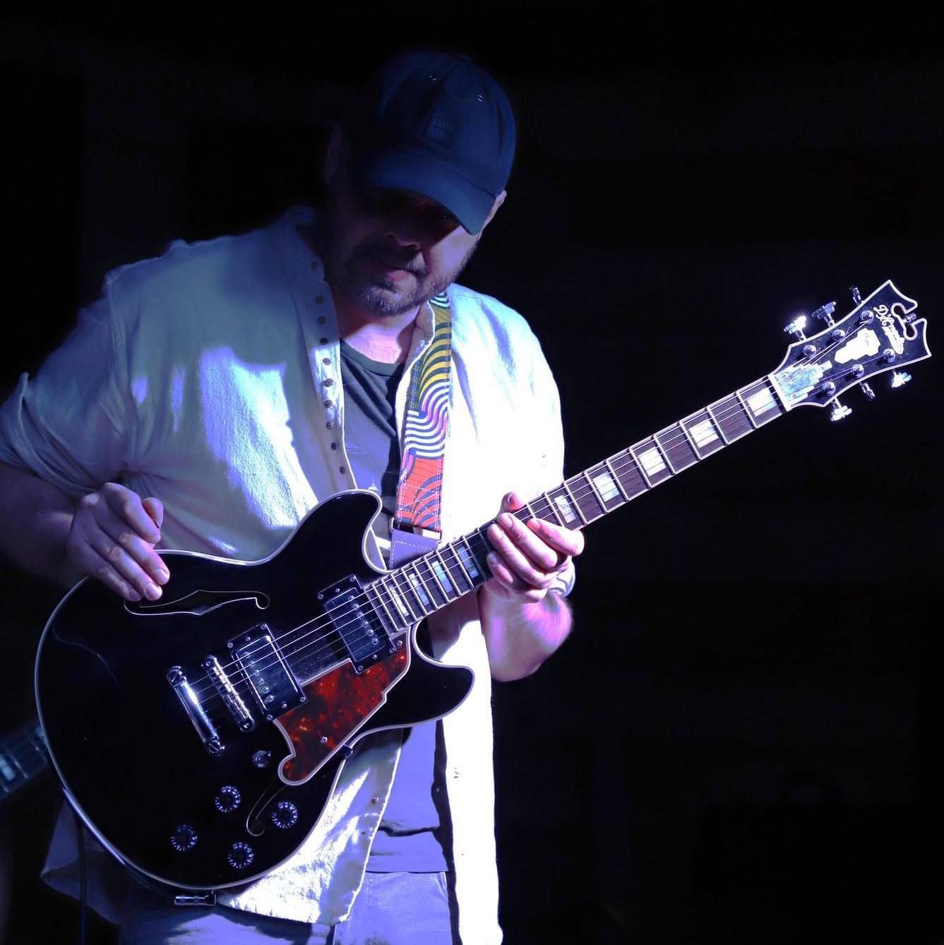 Paul McArdle playing guitar